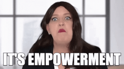 Woman In Wig Making Funny Face Saying It's Empowerment GIF