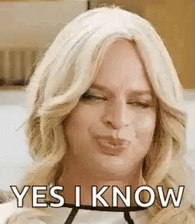 Woman In Wig Making Funny Face Saying Yes I Know GIF