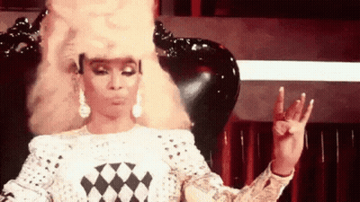 Woman In Wig Making Peace Sign GIF