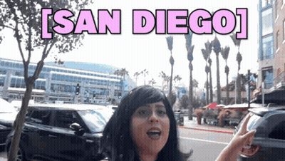 Woman In Wig On Street Saying San Diego GIF