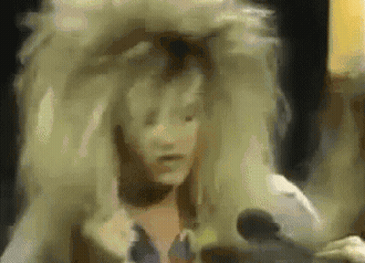 Woman In Wig Talking Into Microphone GIF