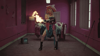 Woman In Witch Costage Holding Flame GIF