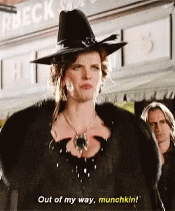 Woman In Witch Costume At Store GIF