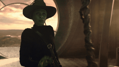 Woman In Witch Costume By Large Window GIF