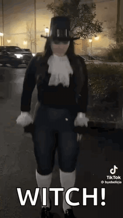 Woman In Witch Costume Holding Umbrella GIF