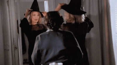 Woman In Witch Costume Looking In Mirror GIF