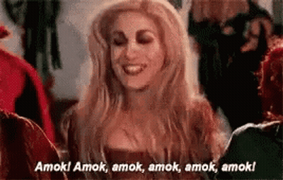 Woman In Witch Costume Smiling Talking To Group GIF