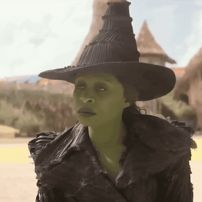 Woman In Witch Costume With Green Eyes GIF