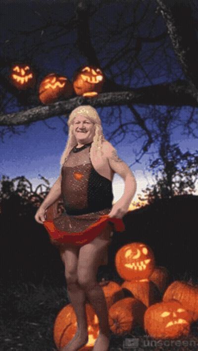 Woman In Witch Costume With Pumpkins GIF