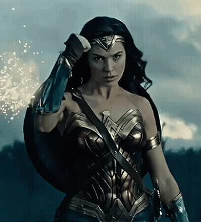 Woman In Wonder Woman Costume Holding Shield GIF