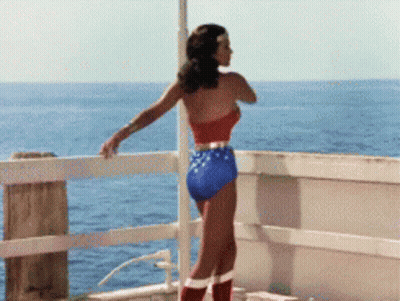 Woman In Wonder Woman Costume Overlooking Ocean GIF