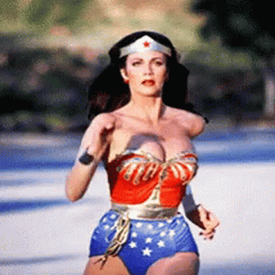 Woman In Wonder Woman Costume Running Down Street GIF