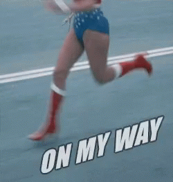 Woman In Wonder Woman Costume Running On Road GIF