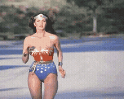 Woman In Wonder Woman Costume Running GIF