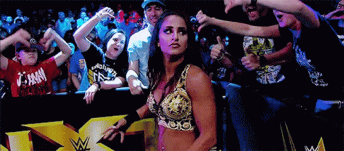 Woman In Wrestling Outfit Thumbs Up To Crowd GIF