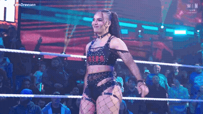 Woman In Wrestling Ring Before Crowd GIF