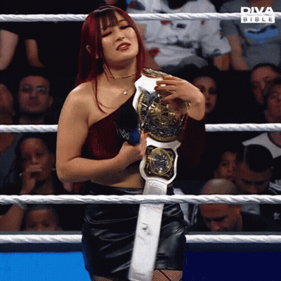 Woman In Wrestling Ring Holding Diva Bible Championship Belt GIF