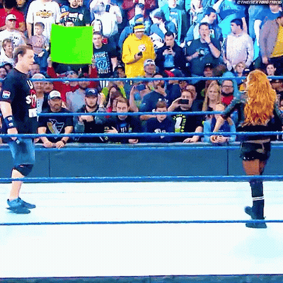 Woman In Wrestling Ring Holding I Love You Sign GIF