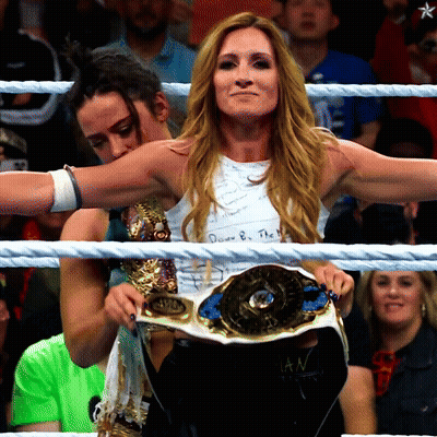 Woman In Wrestling Ring Holding SDD Belt GIF