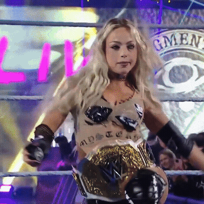 Woman In Wrestling Ring Wearing GMEN Belt GIF