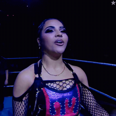 Woman In Wrestling Ring Wearing UFC Shirt GIF