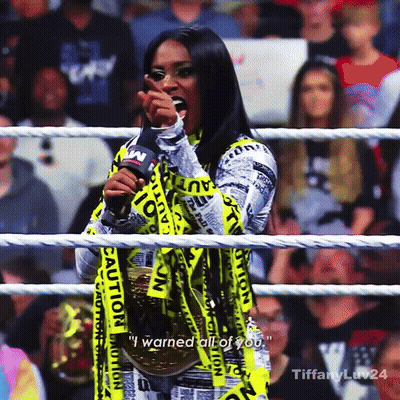 Woman In Wrestling Ring With Caution Tape GIF
