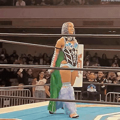 Woman In Wrestling Ring With Crowd GIF