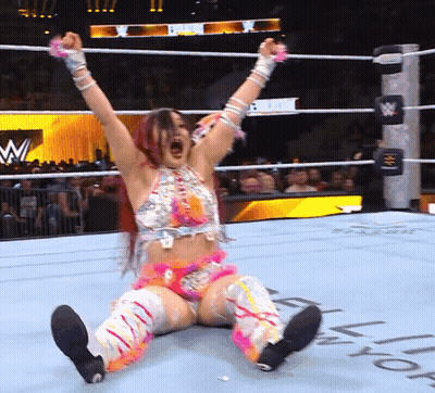 Woman In Wrestling Ring With Letter W GIF