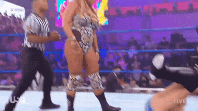 Woman In Wrestling Ring With Referee GIF