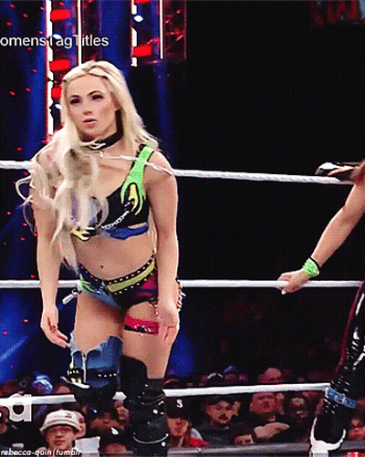 Woman In Wrestling Ring With Womenstag Titles GIF