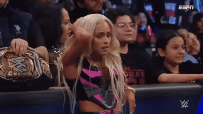 Woman In Wrestling Ring With WWE Championship Belt GIF