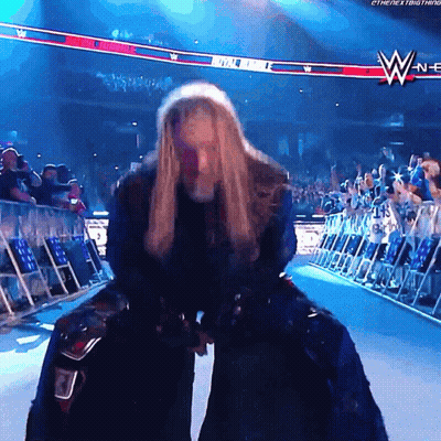Woman In Wrestling Ring With WWE Logo GIF