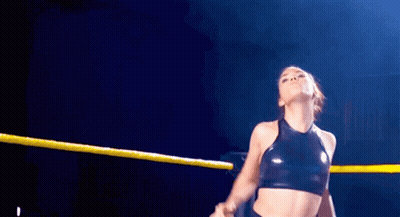 Woman In Wrestling Ring With Yellow Rope Around Waist GIF
