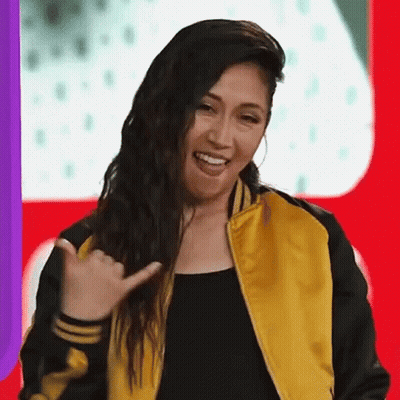 Woman In Yellow And Black Jacket Smiling Funny Face GIF