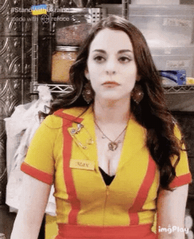 Woman In Yellow And Red Uniform With Name Tag GIF