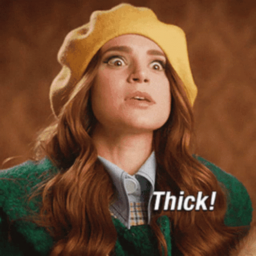 Woman In Yellow Beret And Green Jacket Says Thick GIF