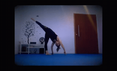 Woman In Yellow Bikini Alternating Side Plank GIF