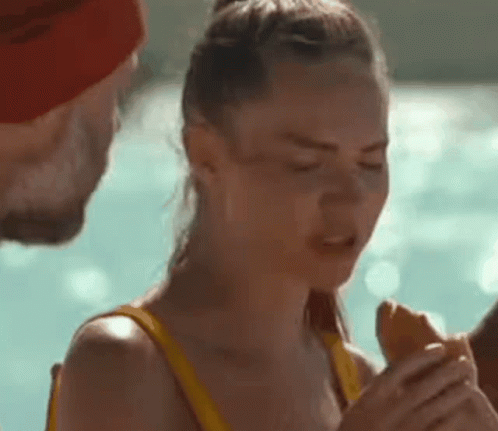 Woman In Yellow Bikini Eating Hot Dog GIF