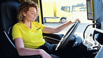 Woman In Yellow Bosch Shirt Driving Truck GIF
