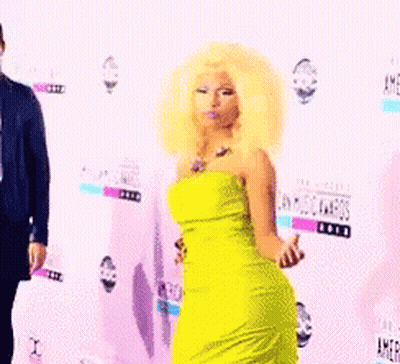 Woman In Yellow Dress At American Music Awards GIF
