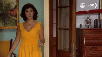 Woman In Yellow Dress At TV GO Sign GIF