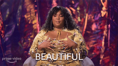 Woman In Yellow Dress By Beautiful Sign GIF