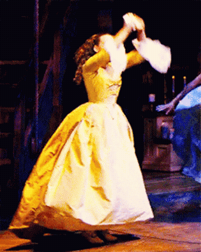Woman In Yellow Dress Dancing On Stage GIF