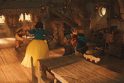 Woman In Yellow Dress Dancing With Dwarfs GIF