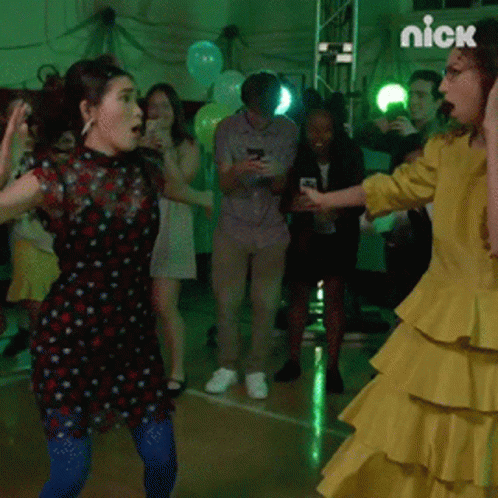 Woman In Yellow Dress Dancing With Nick Logo GIF
