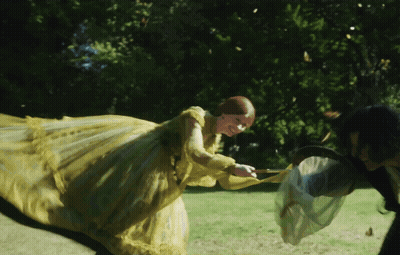 Woman In Yellow Dress Holding Butterfly Net GIF