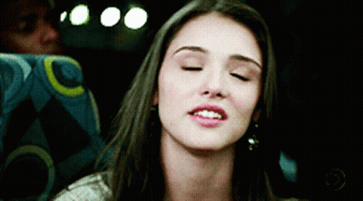 Woman In Yellow Dress Making Funny Face Next To Man GIF