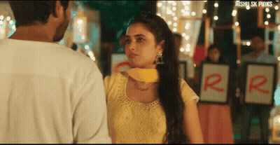 Woman In Yellow Dress Next To Man In White Shirt GIF