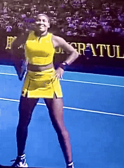 Woman In Yellow Dress On Blue Tennis Court GIF