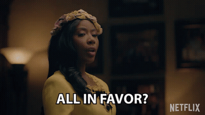 Woman In Yellow Dress Saying All In Favor Next To Netflix Logo GIF